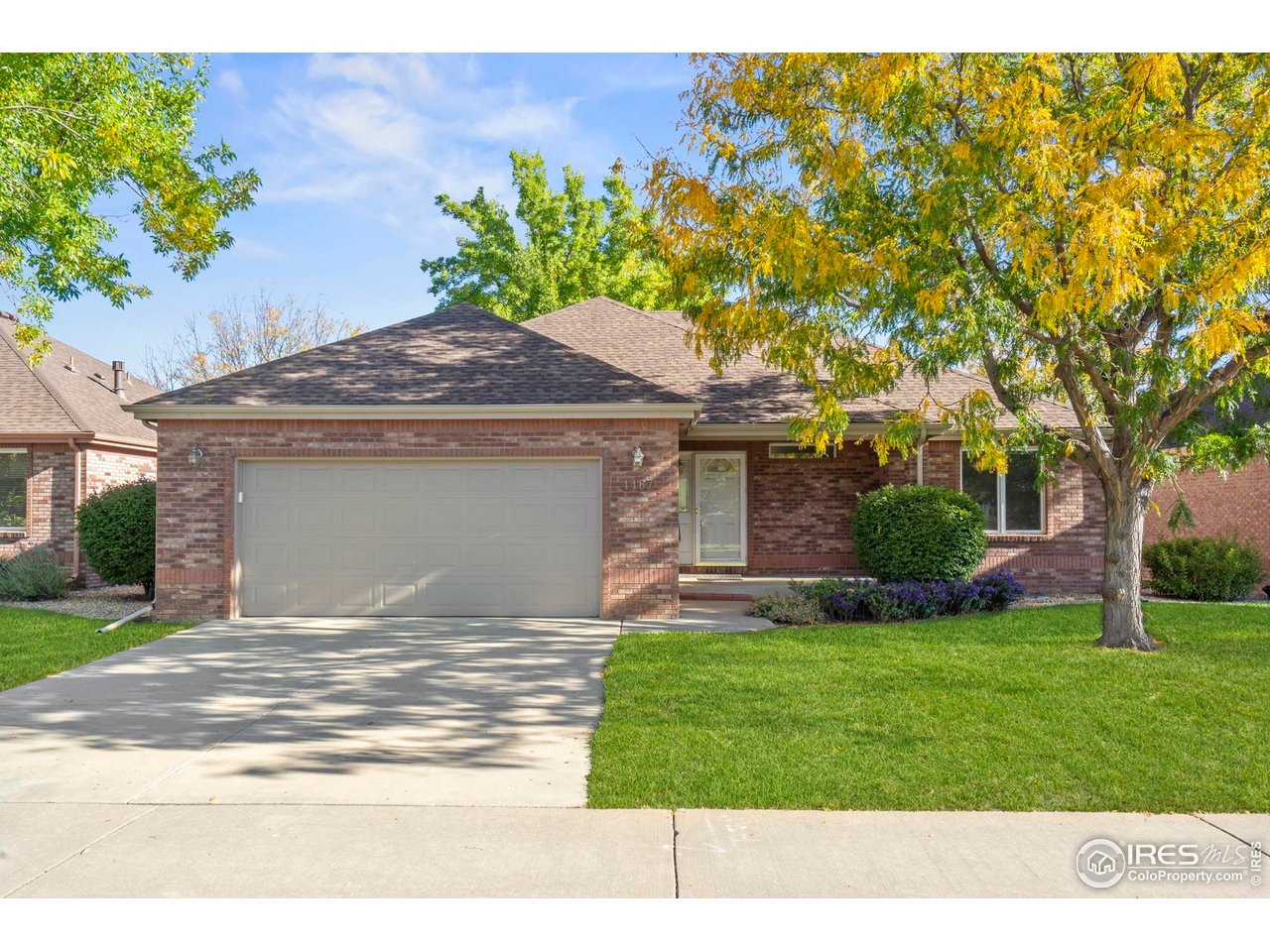 4467 West 17th Street Greeley, CO 80634 - Photo 1 of 48 a house view with a garden space