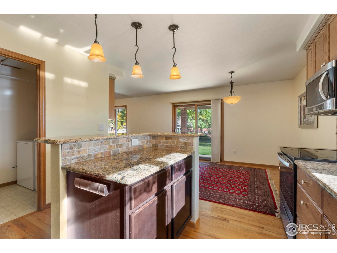 4467 West 17th Street Greeley, CO 80634 - Photo 14 of 48 a view of a kitchen and kitchen island