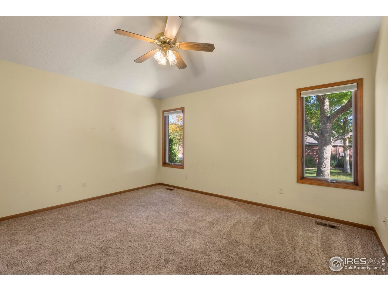 4467 West 17th Street Greeley, CO 80634 - Photo 19 of 48 an empty room with windows and fan