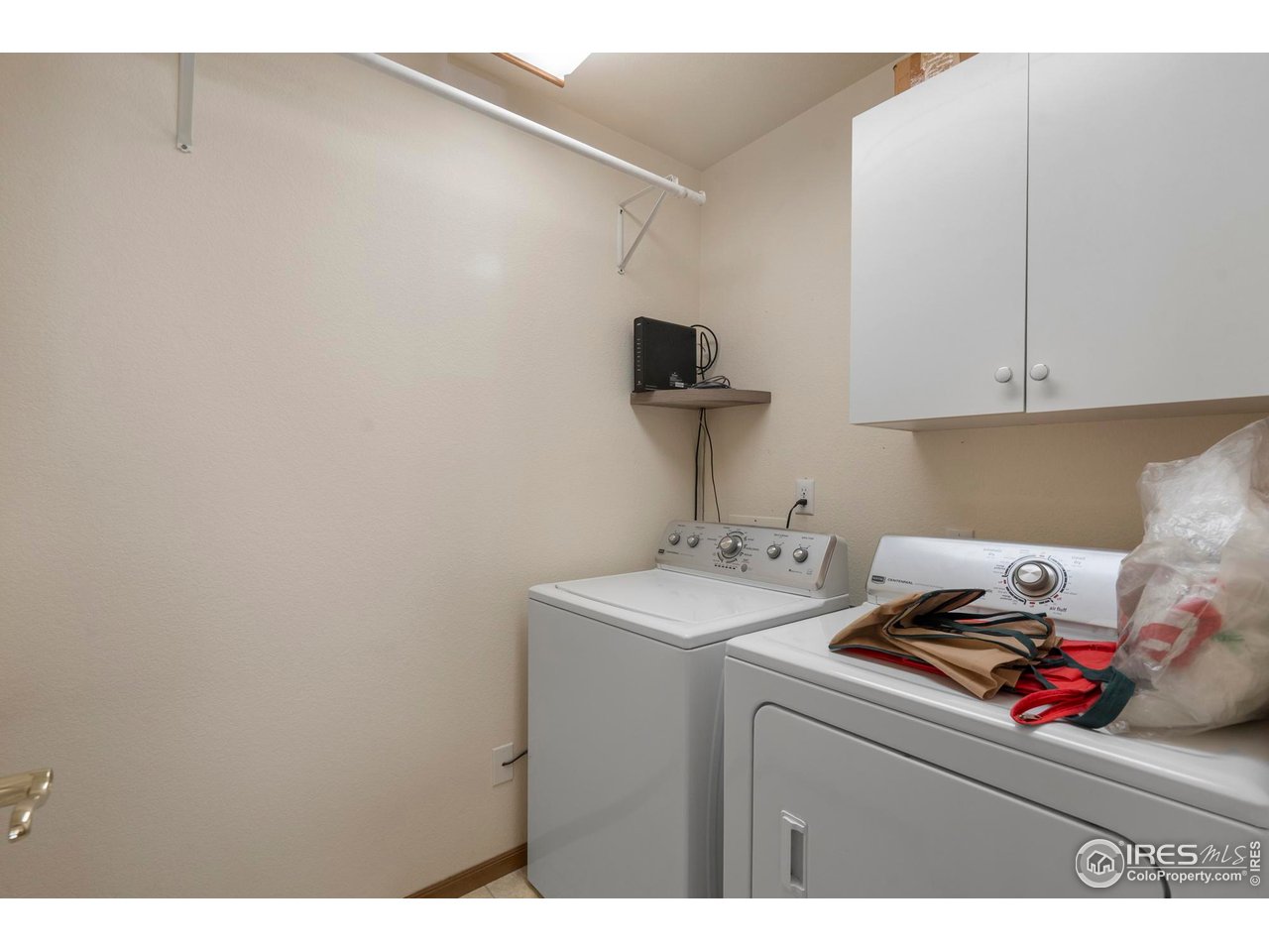 4467 West 17th Street Greeley, CO 80634 - Photo 24 of 48 a utility room with dryer and washer