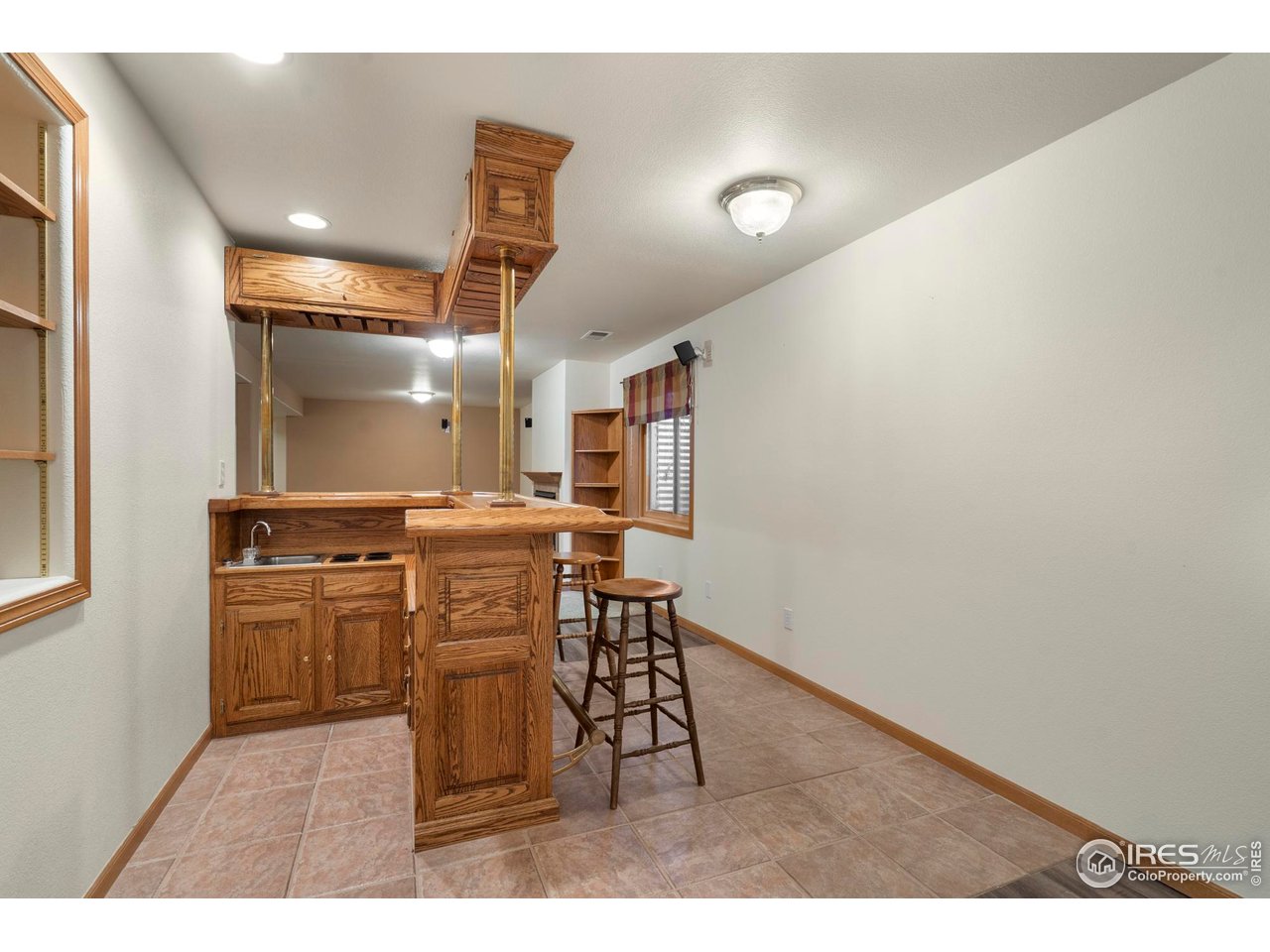 4467 West 17th Street Greeley, CO 80634 - Photo 30 of 48 a kitchen with refrigerator and cabinets