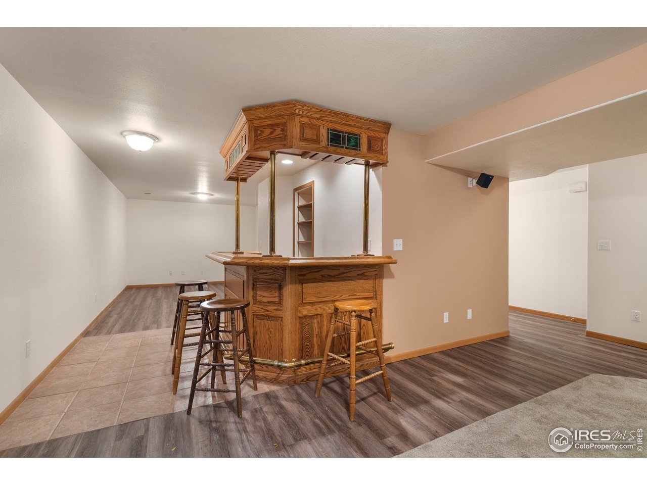 4467 West 17th Street Greeley, CO 80634 - Photo 32 of 48 a view of a hallway with wooden floor