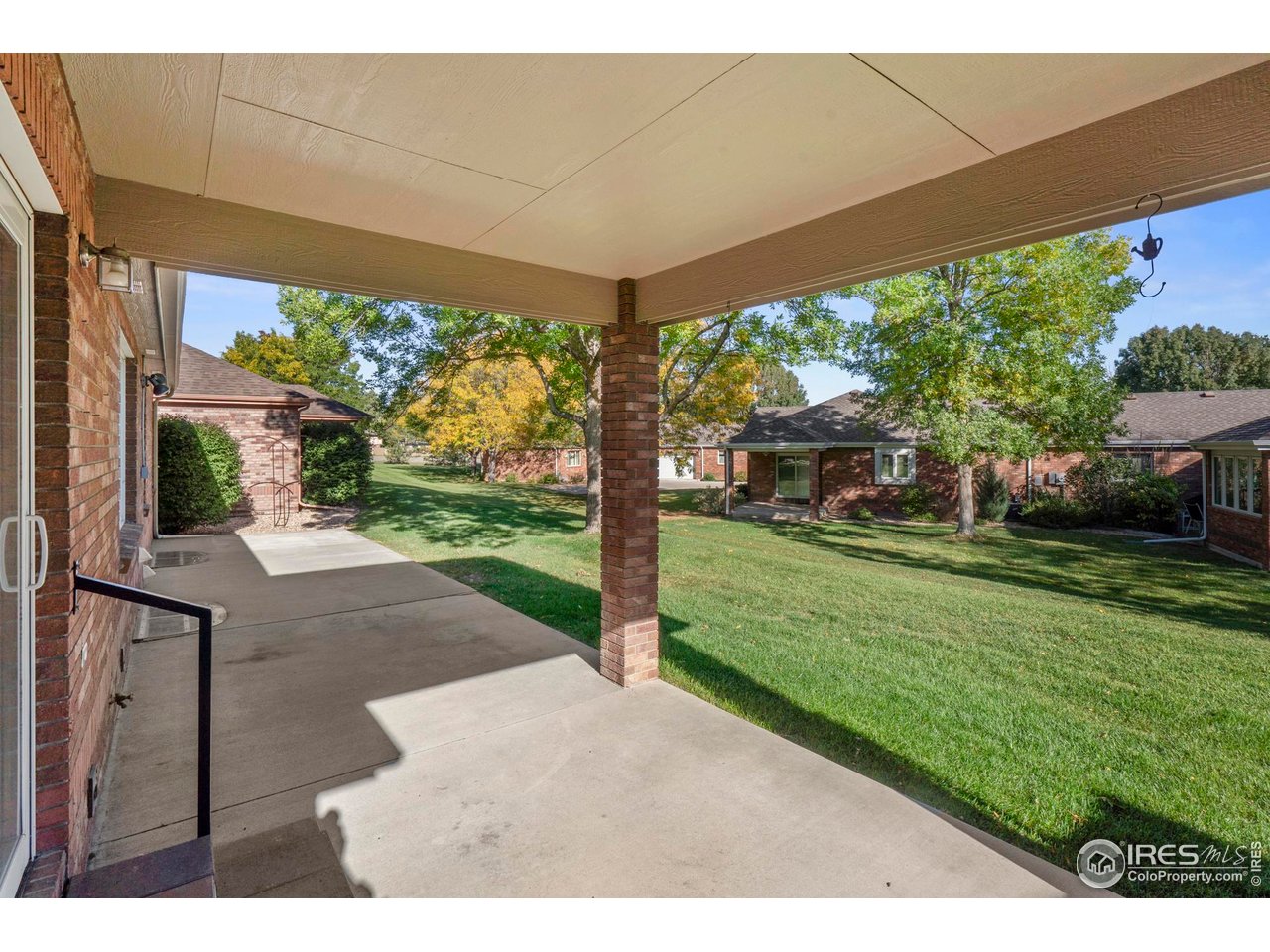 4467 West 17th Street Greeley, CO 80634 - Photo 36 of 48 a view of a porch with a garden