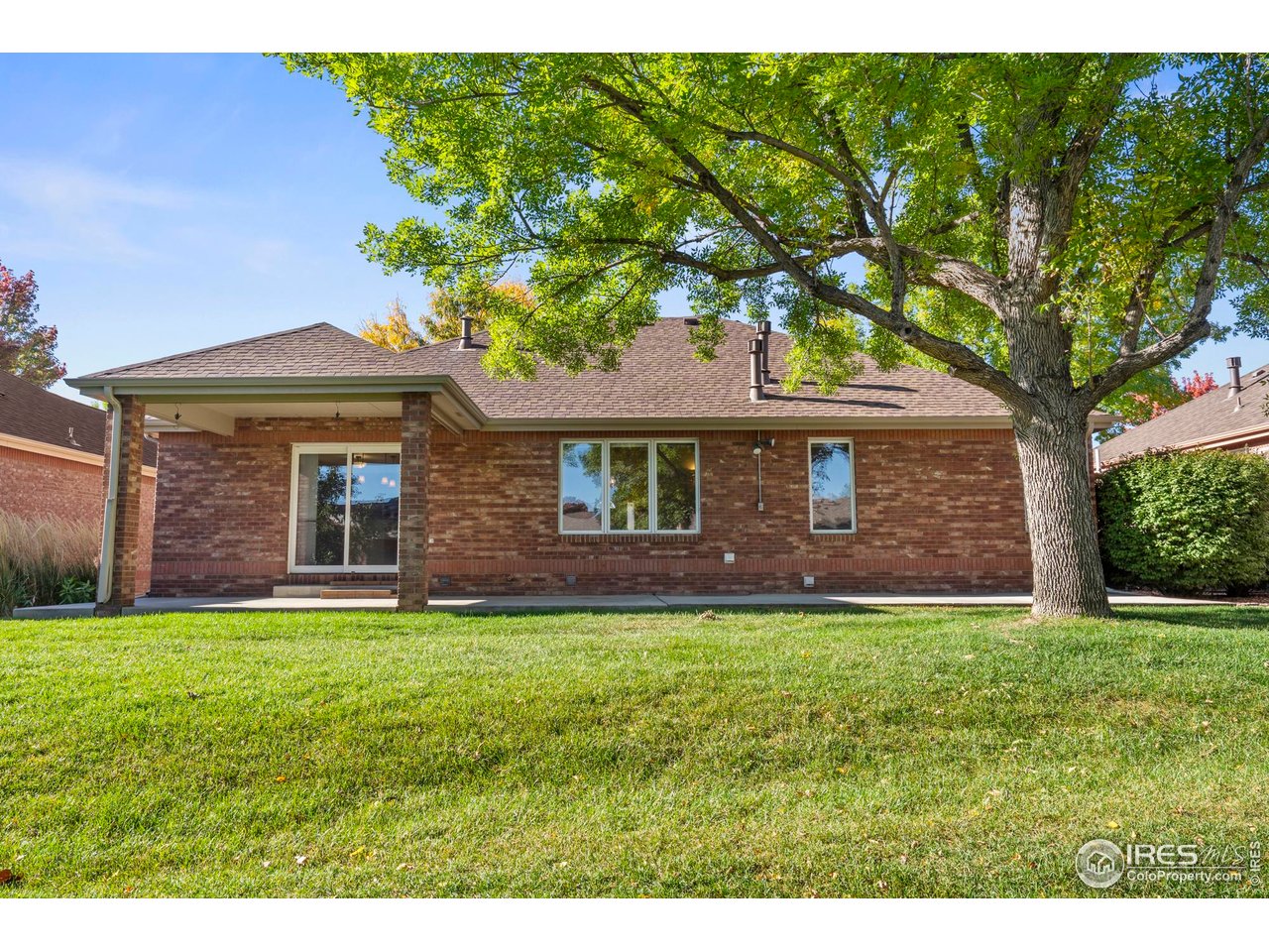 4467 West 17th Street Greeley, CO 80634 - Photo 38 of 48 a front view of a house with a garden