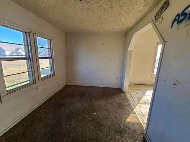 a view of an empty room and window