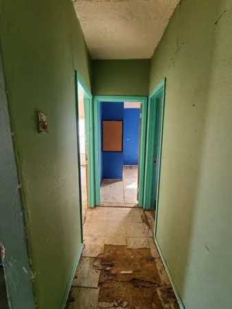 a view of an empty room and window