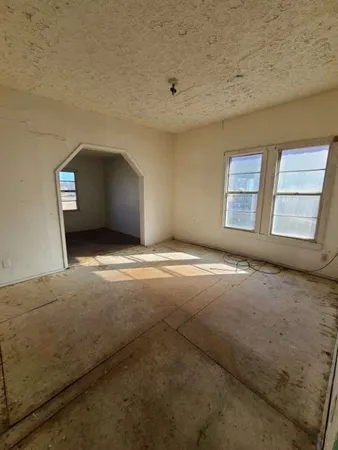 a view of an empty room and window