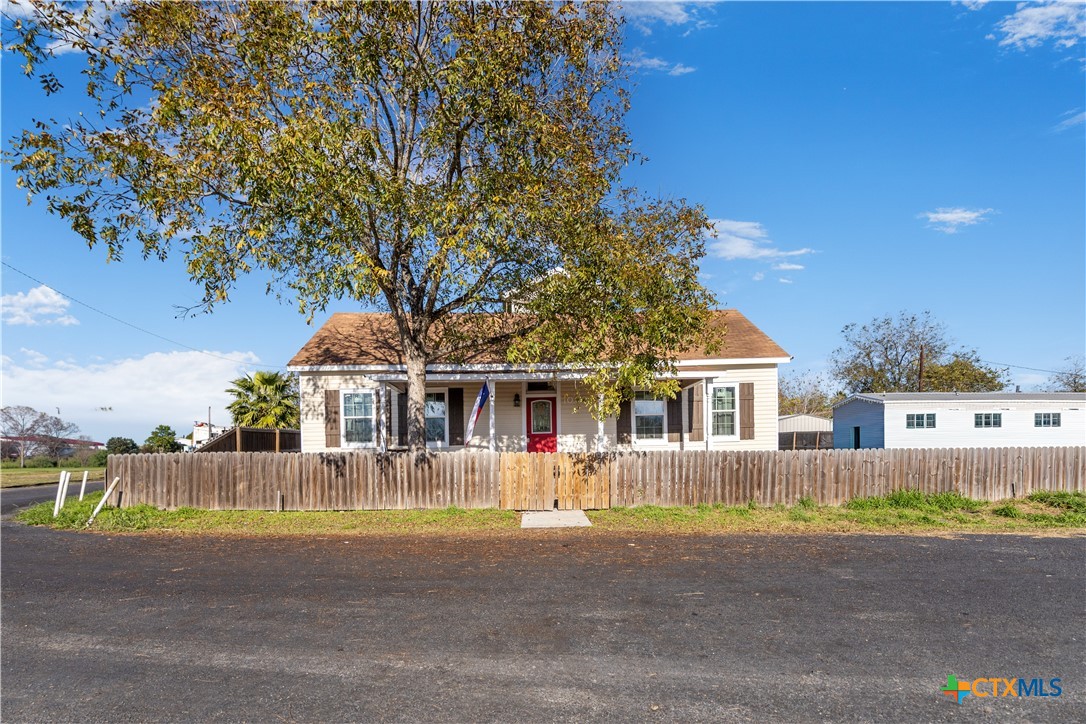 front view of a house with a swimming pool