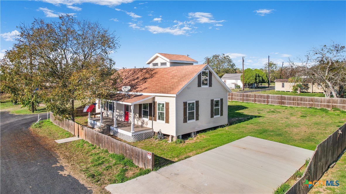 1002 East Commercial Street Victoria, TX 77901 - Photo 25 of 30 a front view of a house with a yard table and chairs
