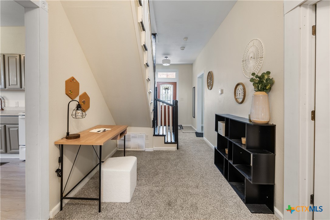 1002 East Commercial Street Victoria, TX 77901 - Photo 7 of 30 a view of a workspace with furniture