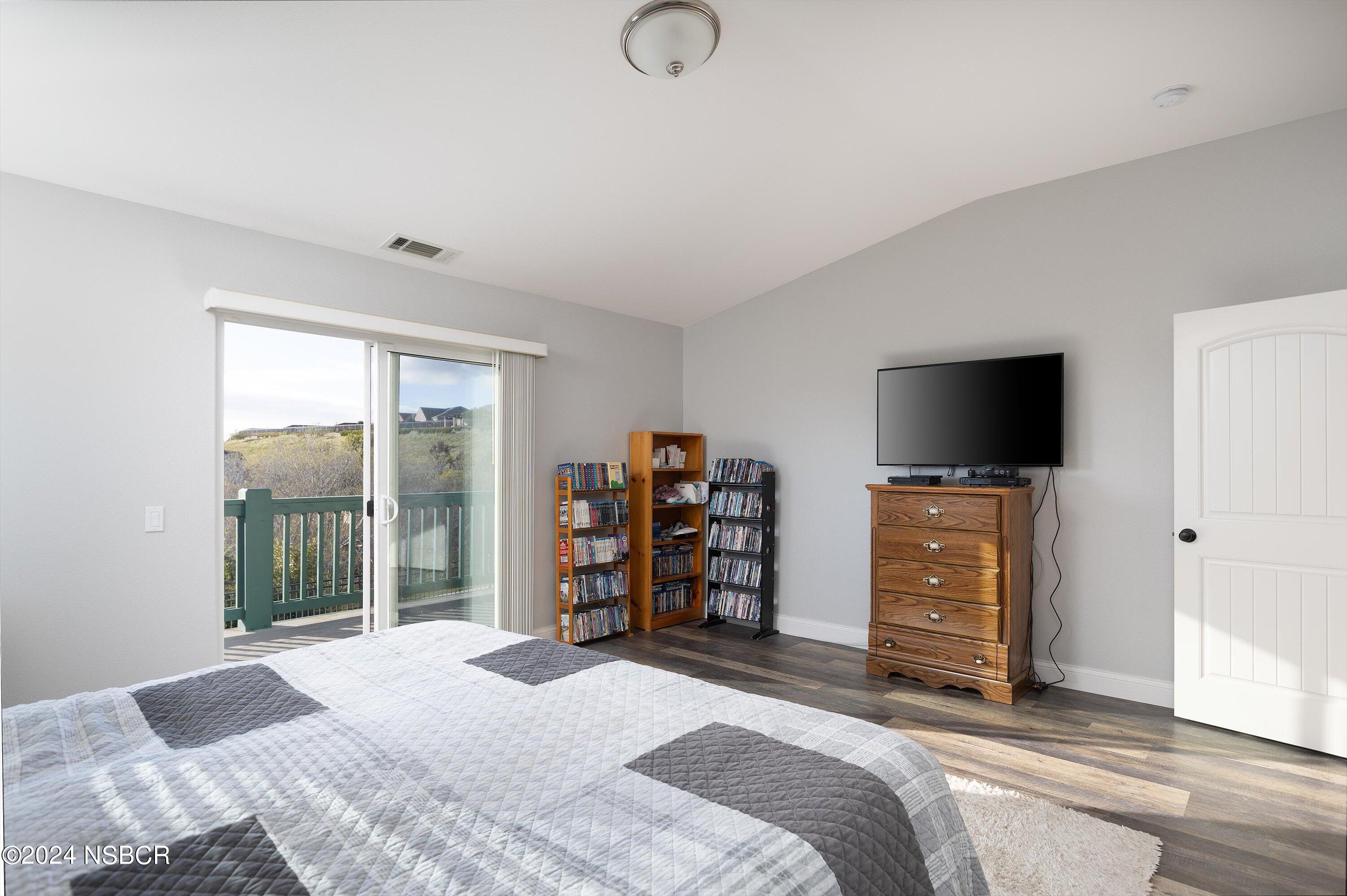 757 Pluto Avenue Lompoc, CA 93436 - Photo 15 of 41 a bedroom with a bed and a flat screen tv