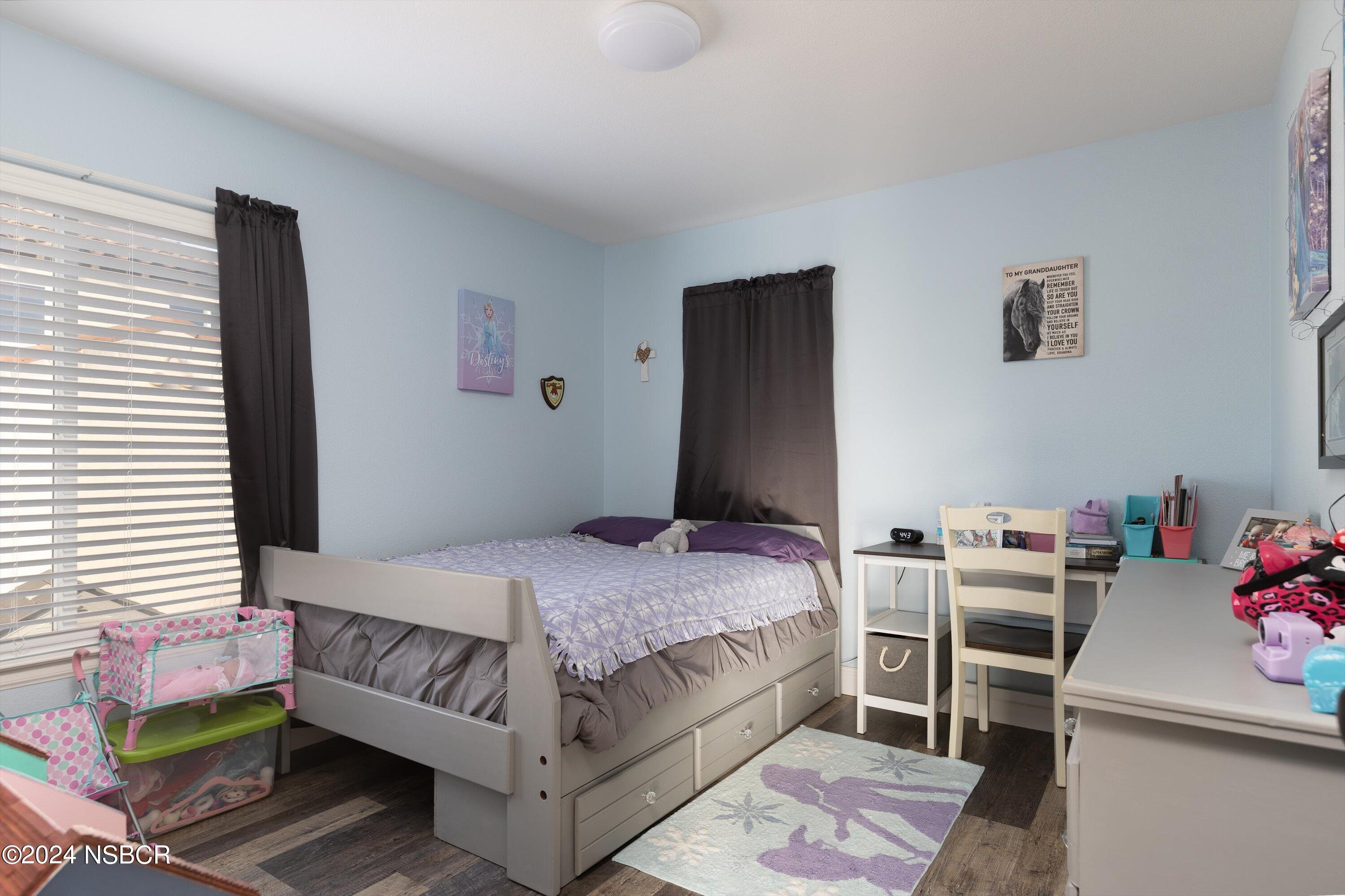 757 Pluto Avenue Lompoc, CA 93436 - Photo 16 of 41 a bedroom with a bed and a dresser