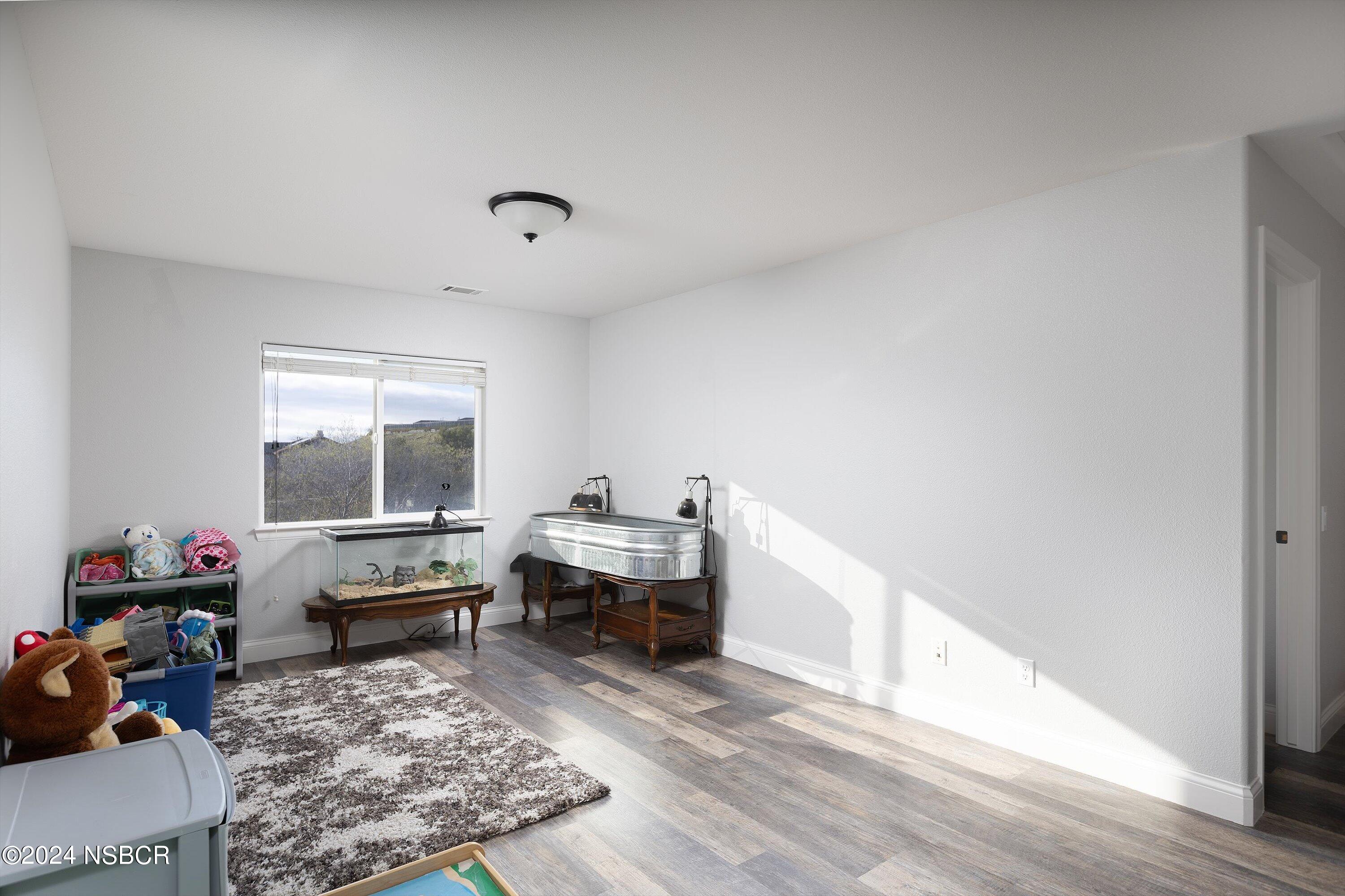 757 Pluto Avenue Lompoc, CA 93436 - Photo 24 of 41 a room with furniture and a window