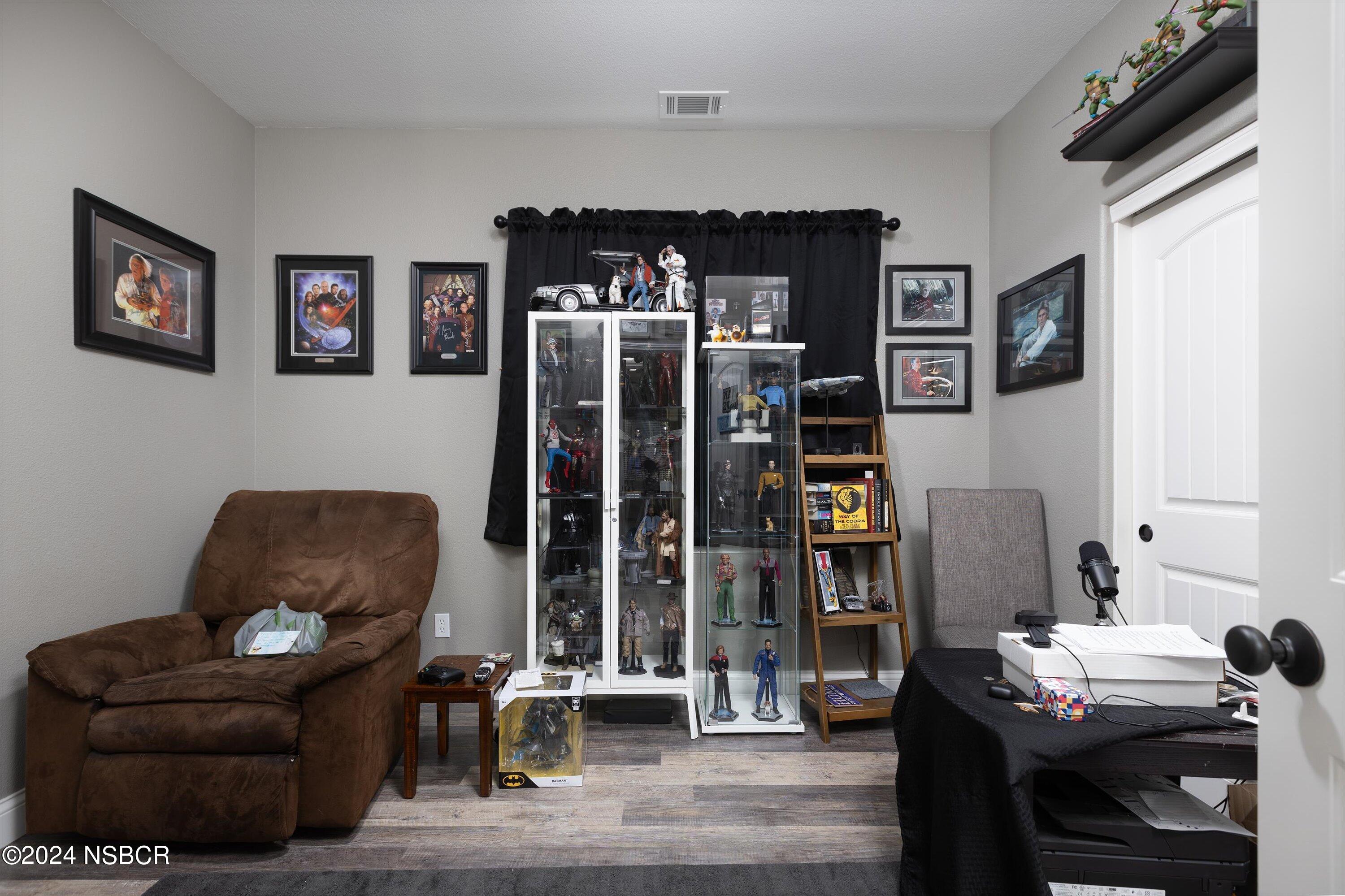 757 Pluto Avenue Lompoc, CA 93436 - Photo 9 of 41 a living room with furniture and book shelf