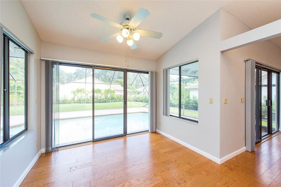 3976 Northwest 23rd Terrace Boca Raton, FL 33431 - Photo 16 of 31 a view of an empty room with wooden floor and a window