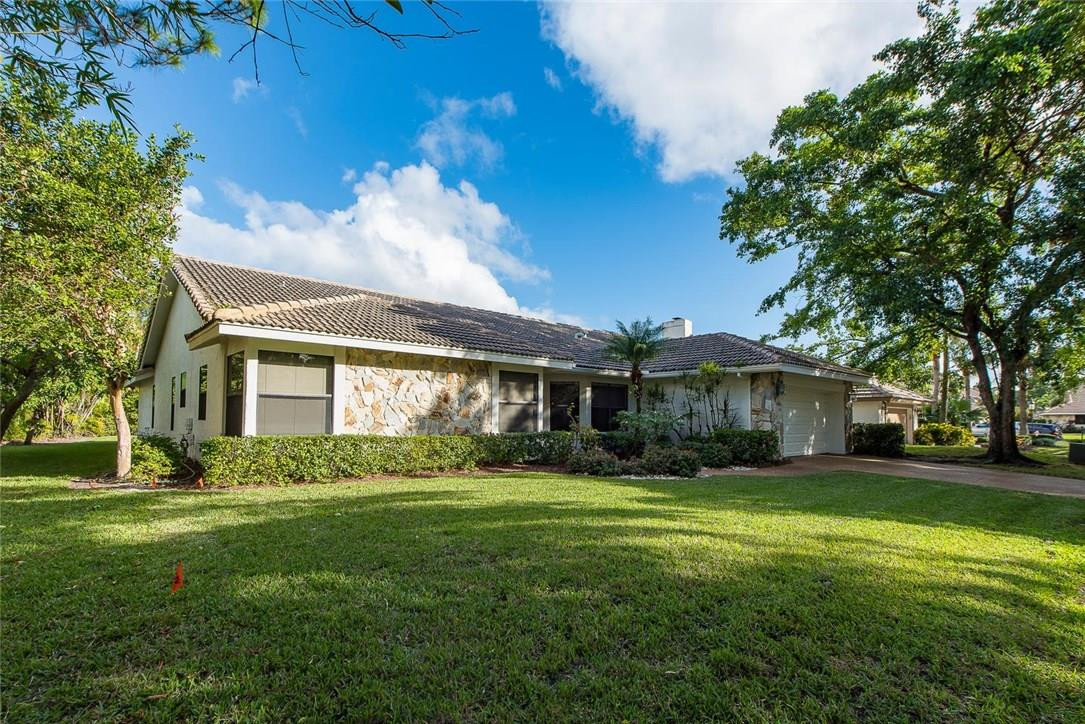 3976 Northwest 23rd Terrace Boca Raton, FL 33431 - Photo 2 of 31 a view of a yard in front of a house
