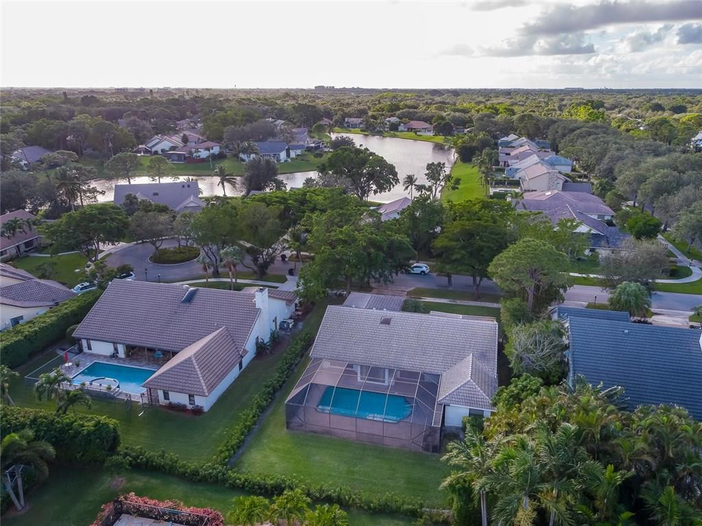 3976 Northwest 23rd Terrace Boca Raton, FL 33431 - Photo 29 of 31 an aerial view of multiple houses with yard