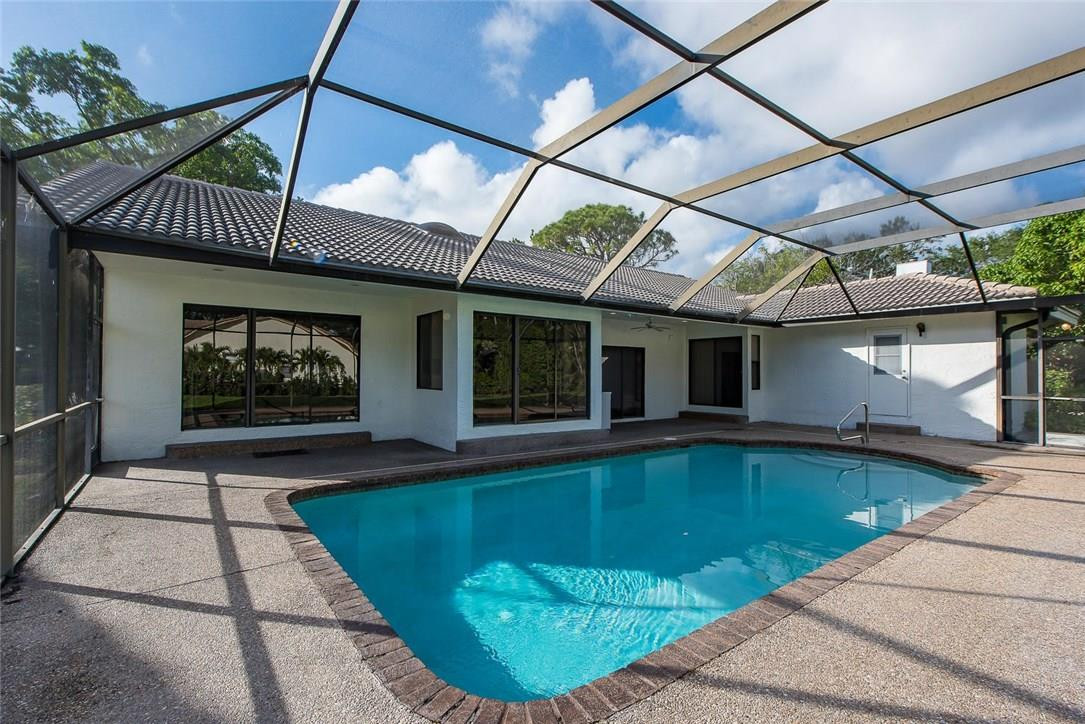 3976 Northwest 23rd Terrace Boca Raton, FL 33431 - Photo 5 of 31 a view of a backyard with pool table and chairs