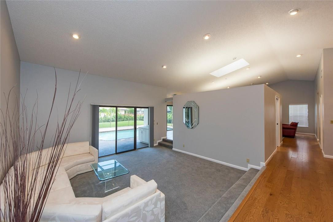 3976 Northwest 23rd Terrace Boca Raton, FL 33431 - Photo 7 of 31 a living room with furniture and a large window