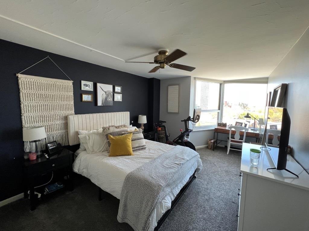 720 West Gordon Terrace, Unit 7F Chicago, IL 60613 - Photo 7 of 19 a bedroom with a bed couch and a window