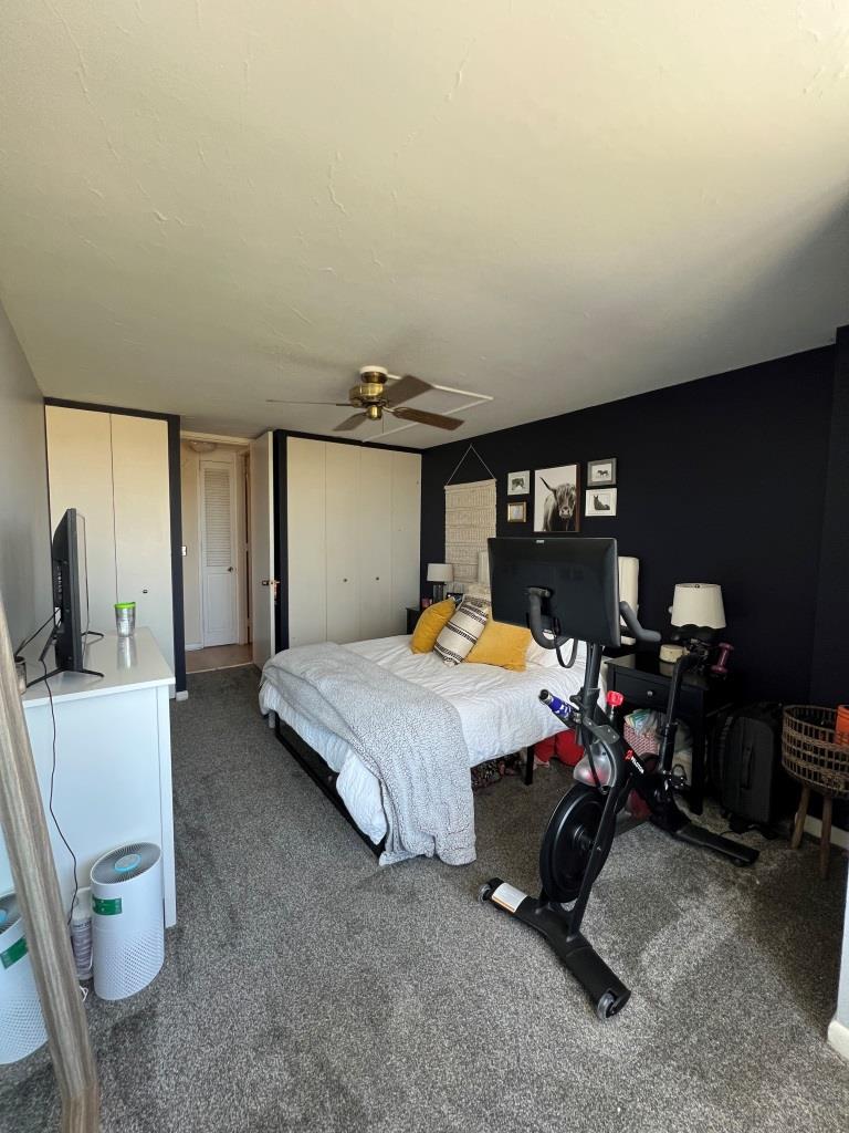 720 West Gordon Terrace, Unit 7F Chicago, IL 60613 - Photo 9 of 19 a bed room with a bed mirror and a chair