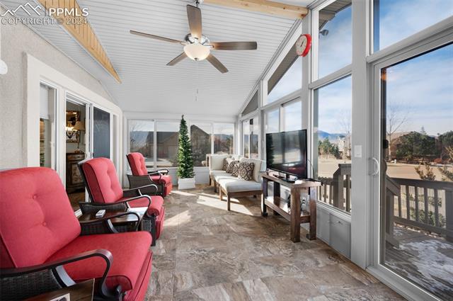 533 Talus Road Monument, CO 80132 - Photo 30 of 46 Sunroom / solarium with lofted ceiling with beams and ceiling fan