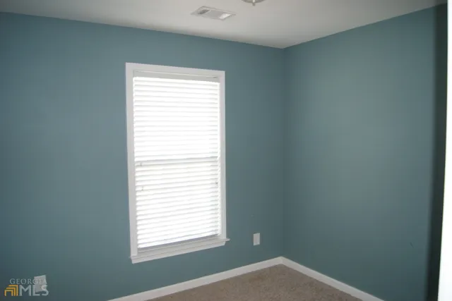 a view of a window in an empty room