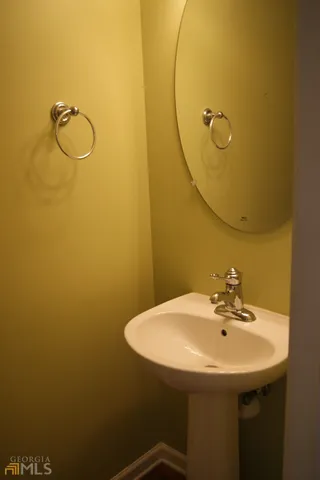 a bathroom with a sink and mirror