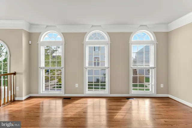 a view of front door with wooden floor