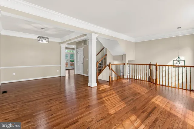 a view of an entryway with wooden floor