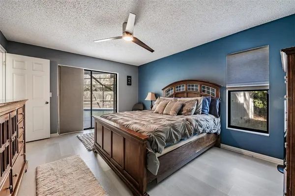 a spacious bedroom with a bed and a window