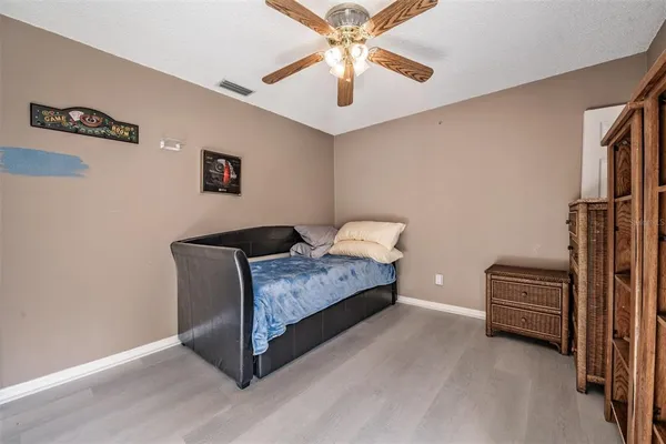 a view of a livingroom with furniture and a ceiling fan