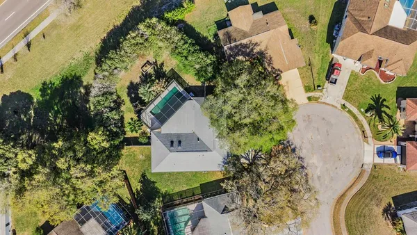 a view of a swimming pool with a patio