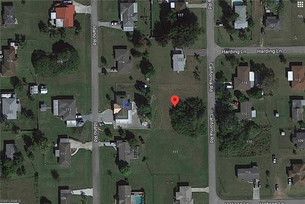 113 California Road Lehigh Acres, FL 33936 - Photo 3 of 3 an aerial view of waterside residential houses