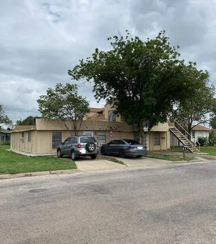 a view of a cars parked in front of a house