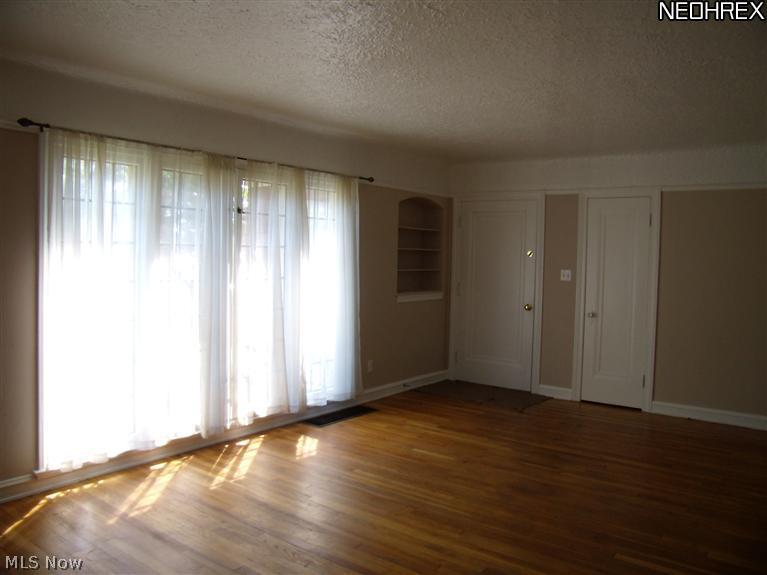 16711 Kenyon Road, Unit DOWN Cleveland, OH 44120 - Photo 3 of 11 The Living Room, view of the front windows.