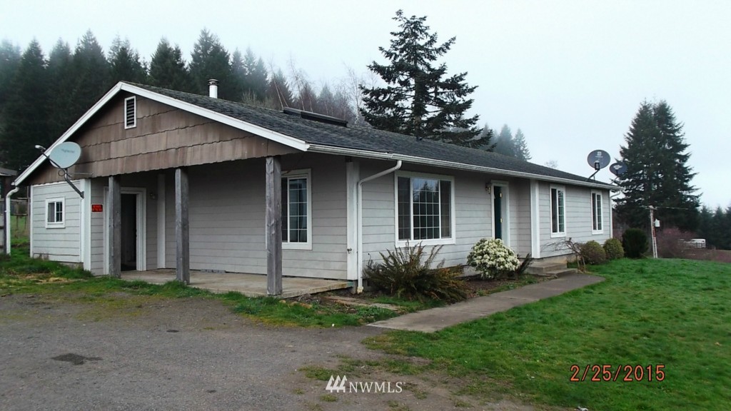 457 Hemenway Road Winlock, WA 98596 - Photo 1 of 24 a front view of a house with garden
