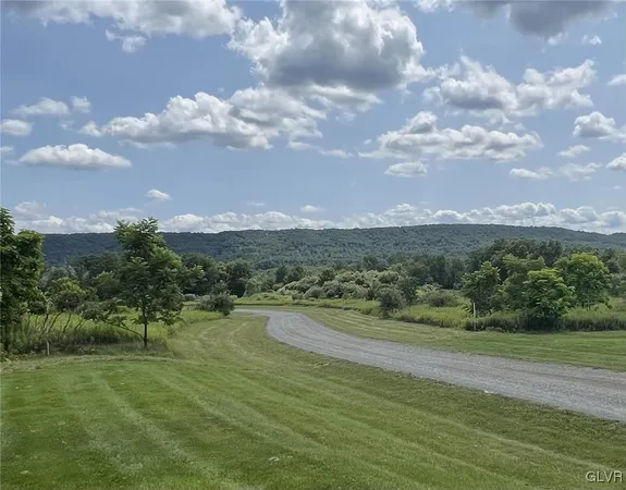 a view of a lake with a big yard