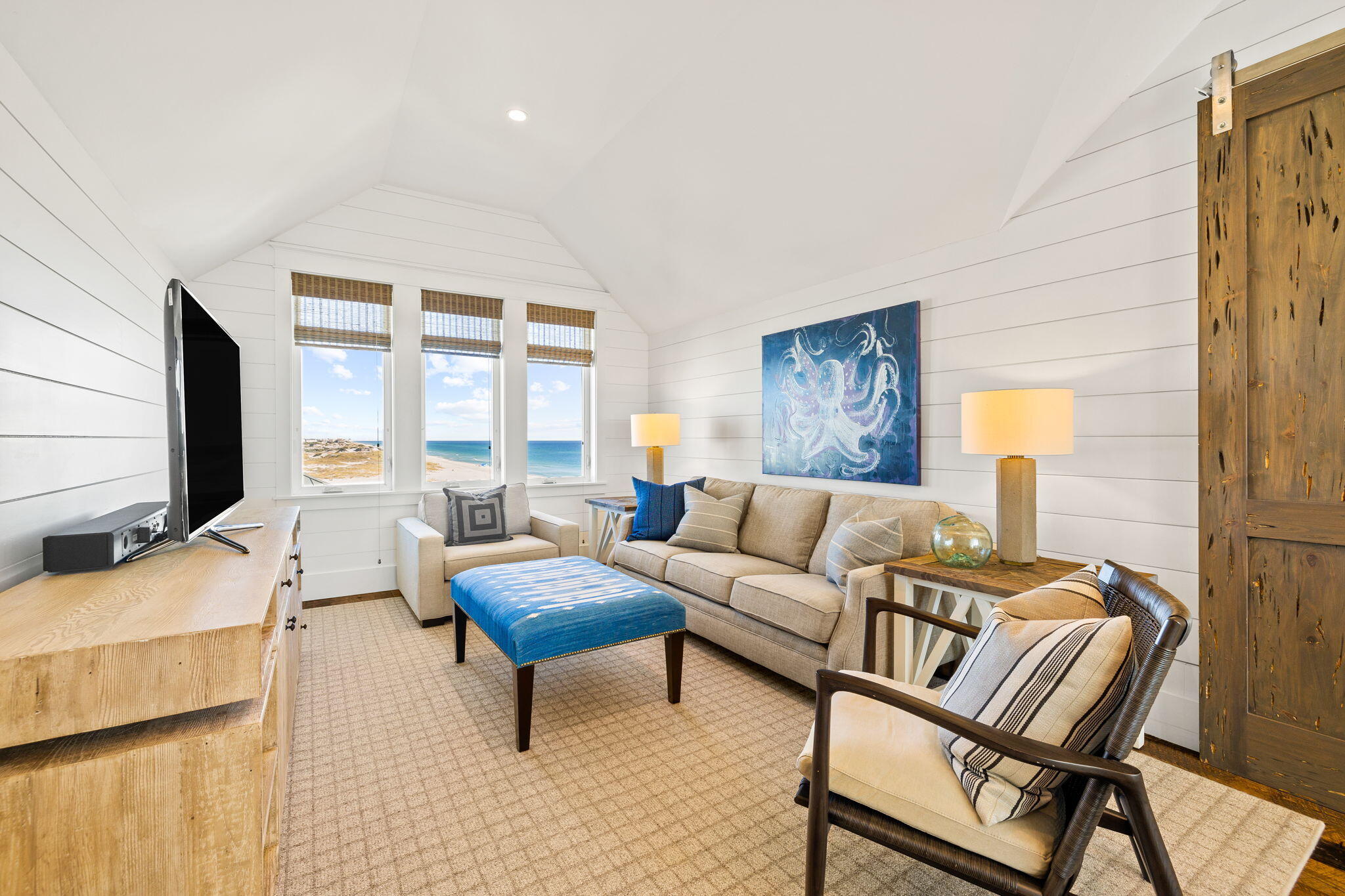 376 Beachfront Trail Santa Rosa Beach, FL 32459 - Photo 41 of 62 a living room with furniture and a flat screen tv