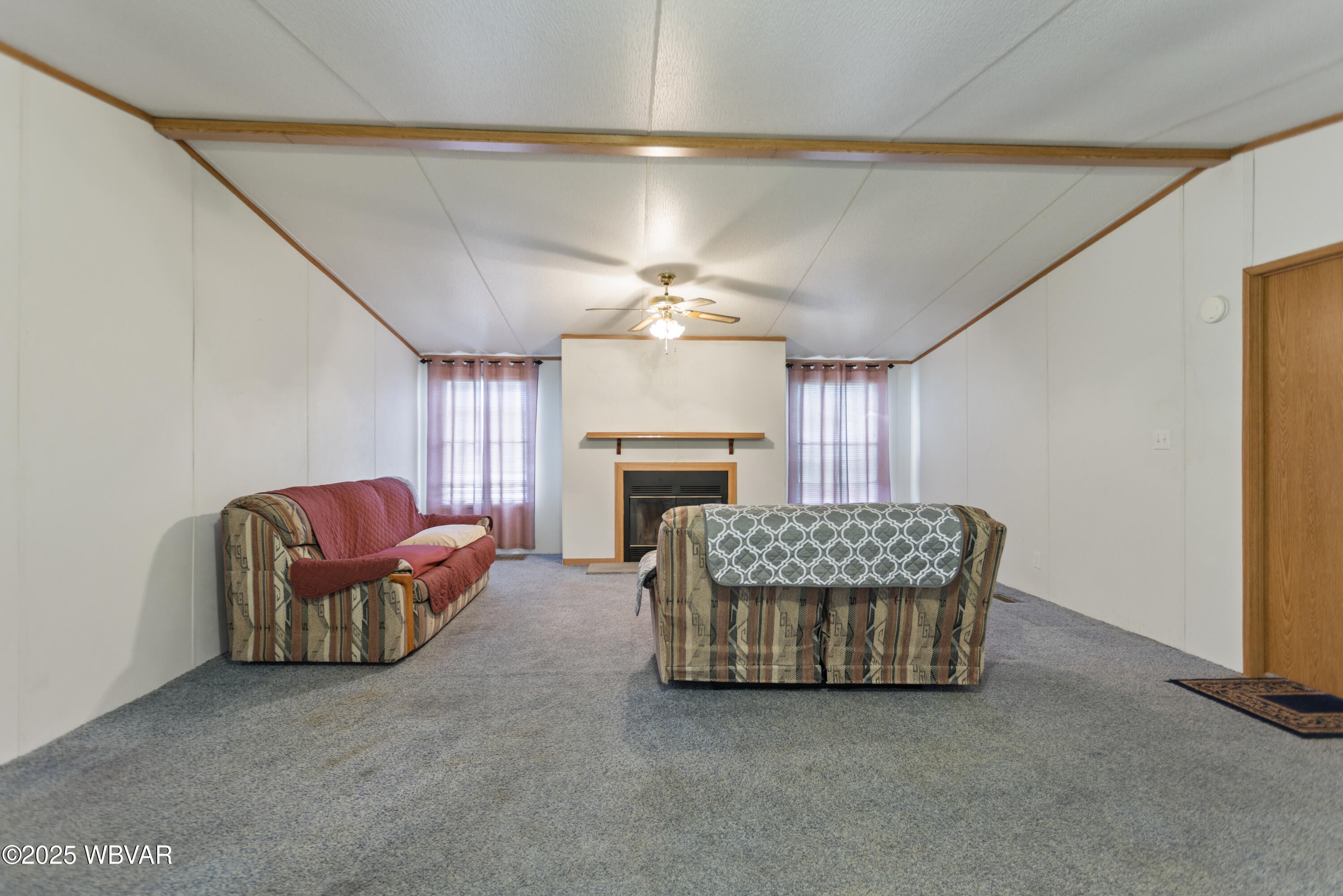 140 Bittner Park Road, Unit 44 Trout Run, PA 17771 - Photo 16 of 31 Living room with wood fireplace. Sofa and loveseat included?