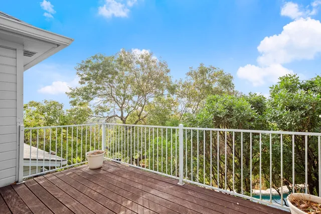 a view of balcony with wooden floor