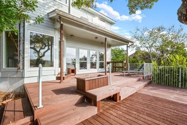 a swimming pool with outdoor seating and yard