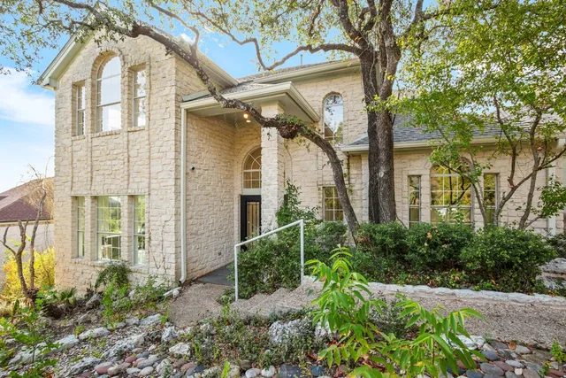 front view of a house with a garden