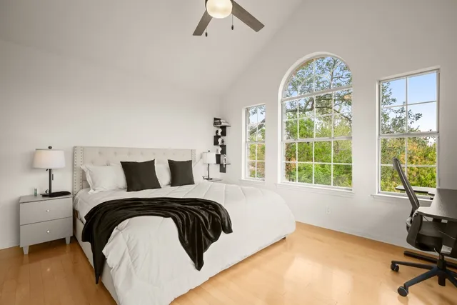 a bedroom with a bed and a table in it