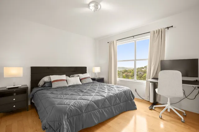 a bedroom with a bed and a chair