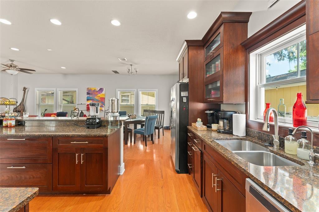 2223 Amherst Avenue Orlando, FL 32804 - Photo 12 of 64 a kitchen with lots of counter top space and dining table