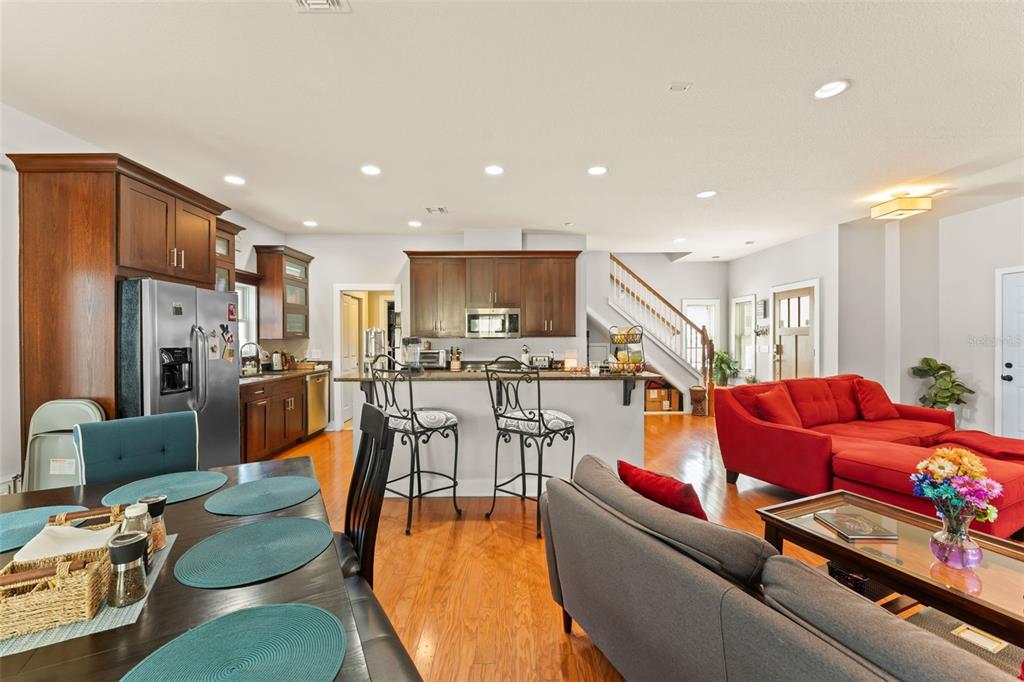 2223 Amherst Avenue Orlando, FL 32804 - Photo 14 of 64 a living room with furniture kitchen view and a chandelier
