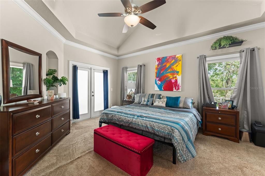 2223 Amherst Avenue Orlando, FL 32804 - Photo 20 of 64 a bedroom with a bed dresser and window