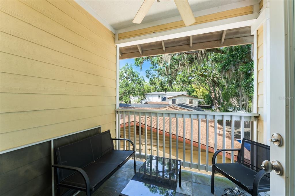 2223 Amherst Avenue Orlando, FL 32804 - Photo 22 of 64 a view of a chair and table in balcony