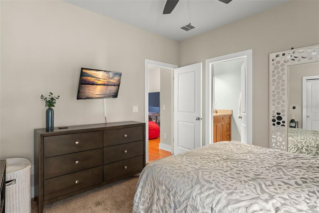 2223 Amherst Avenue Orlando, FL 32804 - Photo 28 of 64 a bedroom with a bed and a flat screen tv